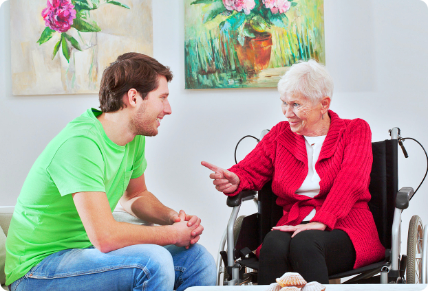 caregiver talking to the senior woman